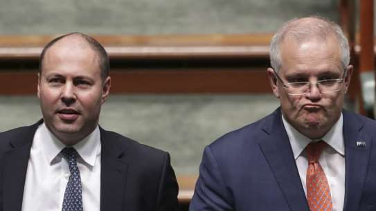 Scott Morrison and Josh Frydenberg ... softening the ground as the chances of a budget surplus diminish.