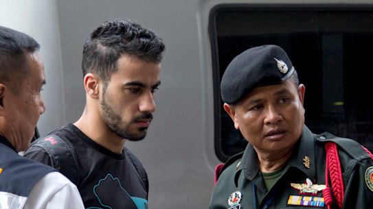 Bahraini football player Hakeem al-Araibi, centre, is brought in to a court in Bangkok, Thailand, on Tuesday. 