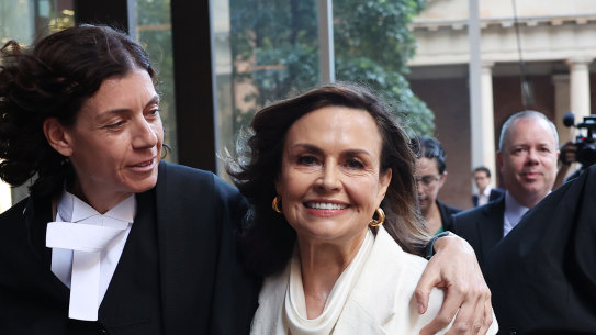 Sue Chrysanthou, SC, hugs Lisa Wilkinson as they emerge from the Federal Court on Monday.