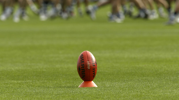 Brawl ends girls' footy game after players start 'slapping each other'