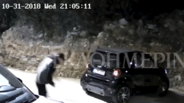 CCTV footage obtained by Greek media shows a gunman approaching the car of Sydney gangster John Macris.