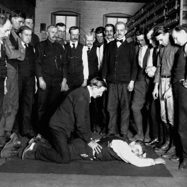 A demonstration of artificial respiration to workers at the Chesapeake & Potomac Telephone Company in Washington DC in 1922. 