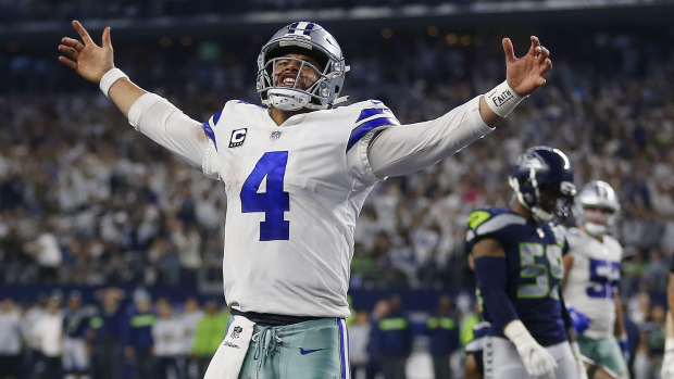 Cowboys quarterback Dak Prescott celebrates on his way to victory in the wildcard game.