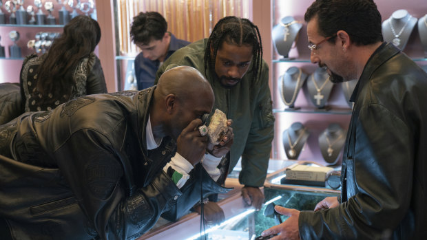 Kevin Garnett, Lakeith Stanfield and Adam Sandler in a scene from Uncut Gems.