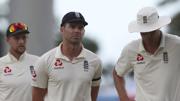 Humbling: (left to right) England captain Joe Root, James Anderson and Stuart Broad after another heavy loss.