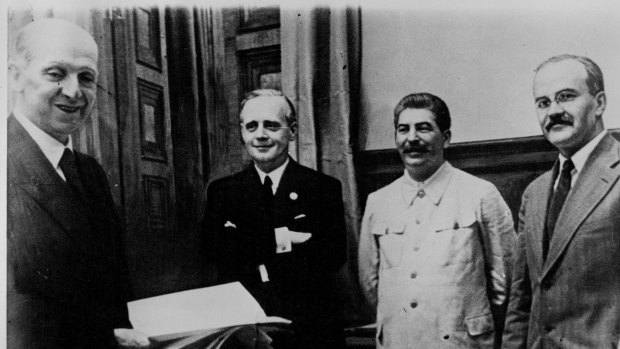 The conclusion of the Soviet-German Non-Aggression Treaty, known as the Molotov-Ribbentrop Pact, which later set scene for the invasion of Poland. From left to right: F. Gaus, Joachim von Ribbentrop, Josef Stalin, Viachislav Molotov on January 1, 1939.