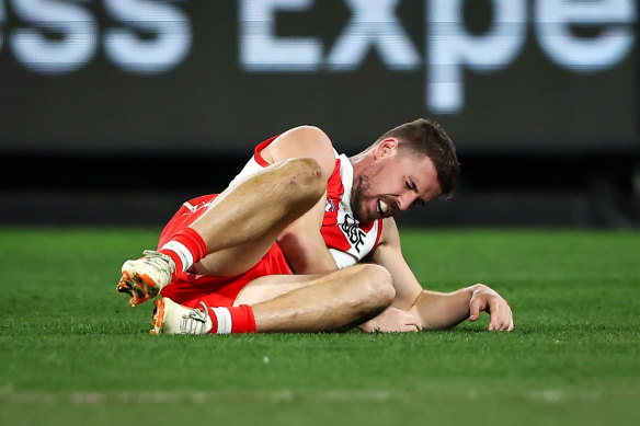 Down and out: Jake Lloyd was subbed out of the game after a bump from Toby Nankervis.
