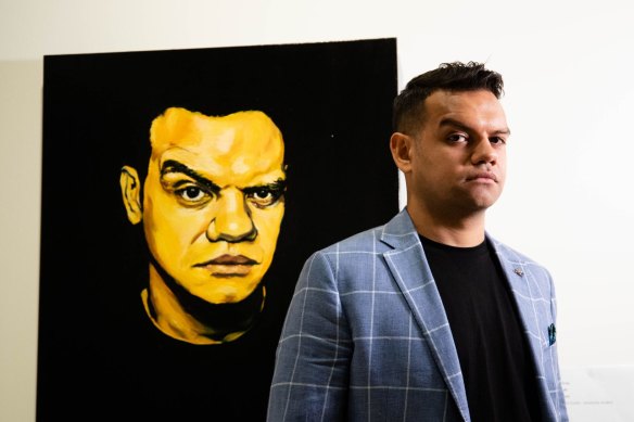 Meyne Wyatt with his self-portrait that won the Packing Room Prize at this year's Archibald Prize. 