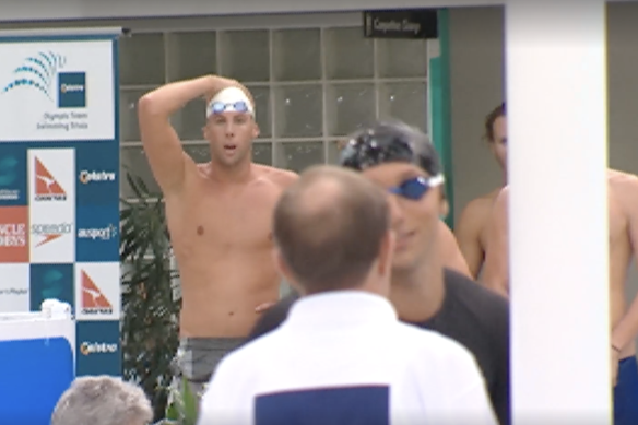 Grant Hackett looks on as Ian Thorpe is disqualified. 