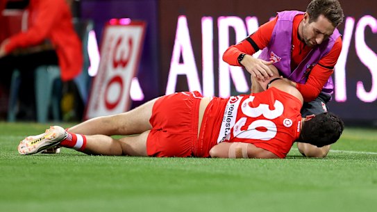 Paddy McCartin receives attention from a trainer after suffering another concussion.