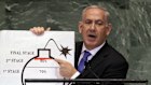 Israeli Prime Minister Benjamin Netanyahu in 2012 with an illustration reflecting his concerns over Iran’s nuclear ambitions during an address to the United Nations General Assembly.