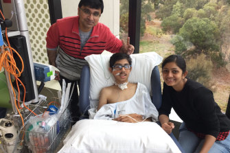 Soham Patel at the Royal Children’s Hospital, with father Nikunj and mother Priyam, recovering from encephalitis in 2018.