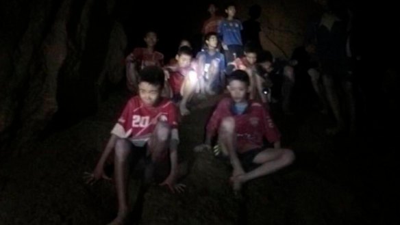 A photo released by Tham Luang Rescue Operation Centre during the rescue mission that shows the boys and their soccer coach as they were found in a partially flooded cave in Thailand.