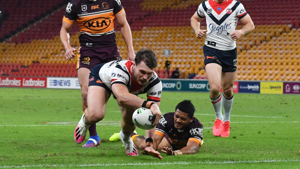 Angus Crichton goes over for one of the Roosters' 10 tries against the Broncos on Thursday night.