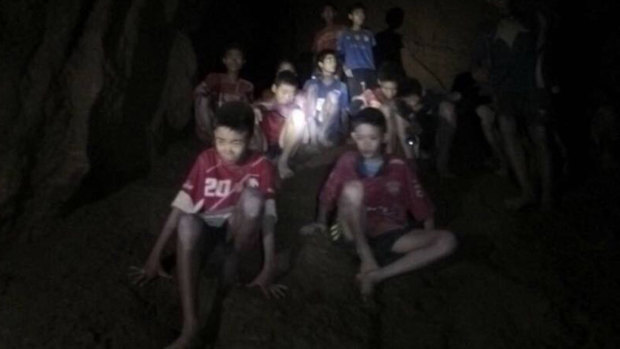 A photo released by Tham Luang Rescue Operation Centre during the rescue mission that shows the boys and their soccer coach as they were found in a partially flooded cave in Thailand.