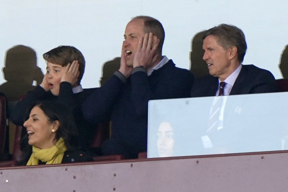 Britain’s Prince William and Prince George (left) watch an English Premier League soccer match in April.