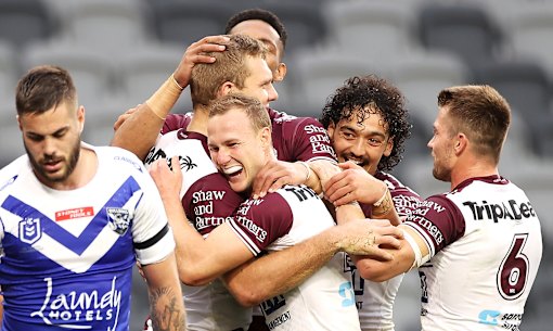 Tom Trbojevic celebrates one of his three tries with Sea Eagles teammates.