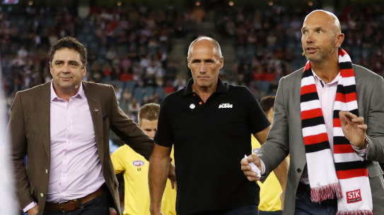 Garry Lyon, Tony Lockett and Stewart Loewe pause to remember Danny Frawley.