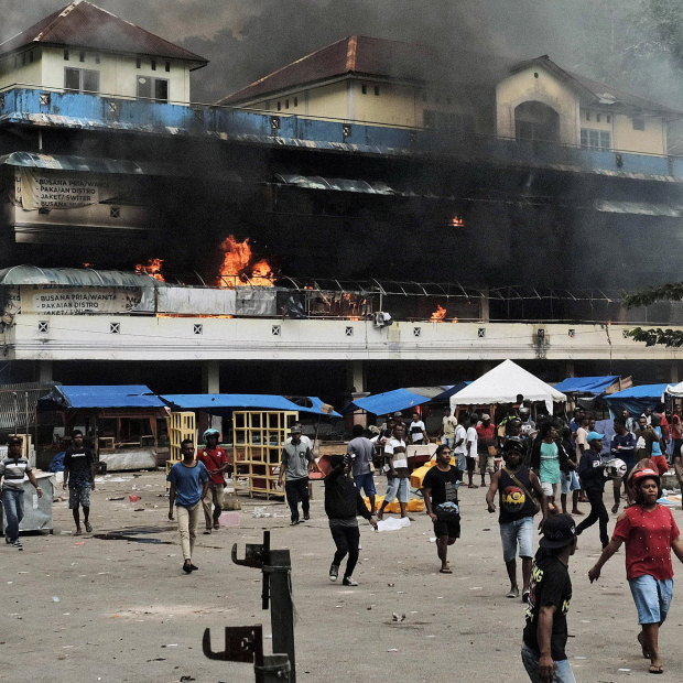 A market burns during a protest in Fakfak, Papua, on August 21.