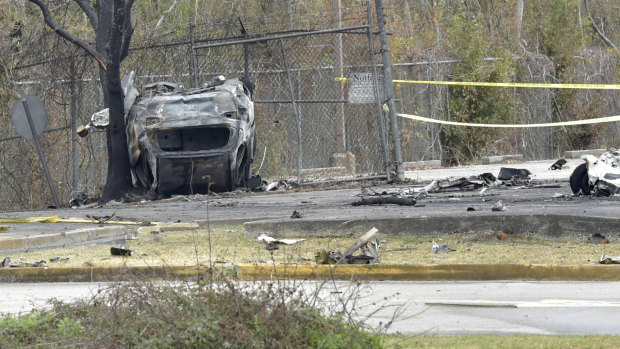 A view of a damaged vehicle near the site of the plane crash in Lafayette, Louisiana.