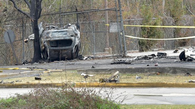 A view of a damaged vehicle near the site of the plane crash in Lafayette, Louisiana.