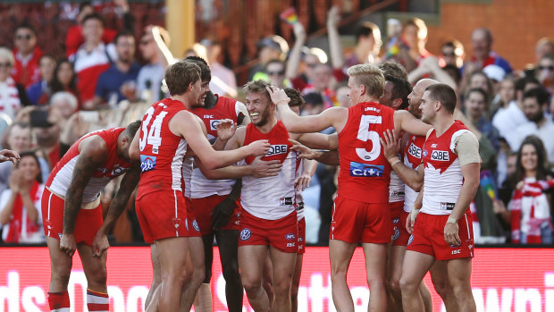 Kieren Jack celebrates after kicking a goal in his final match for the Swans.