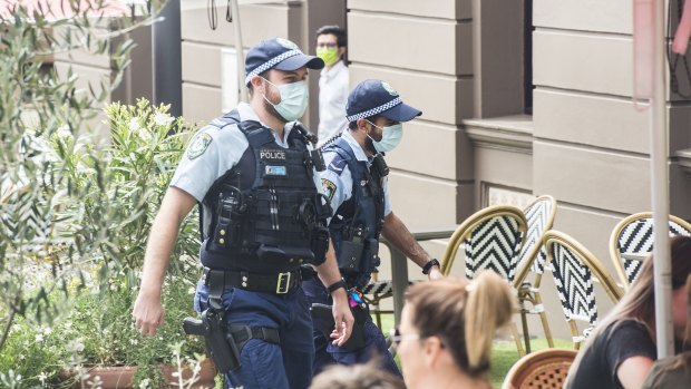 Police wearing masks in Sydney's CBD on Monday.