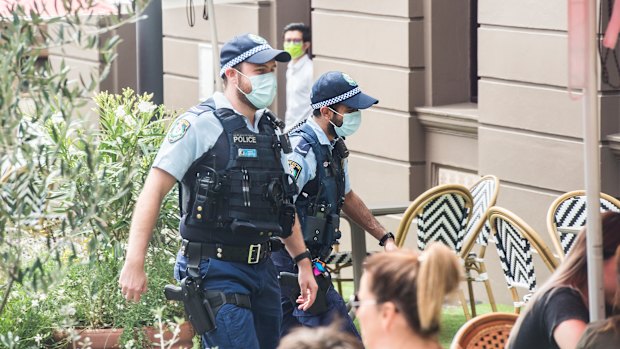 Police wearing masks in Sydney's CBD on Monday.