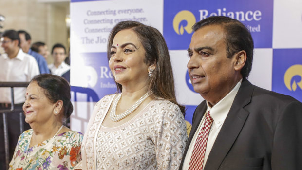 Mukesh Ambani, pictured here with his wife Nita and mother Kokilaben.