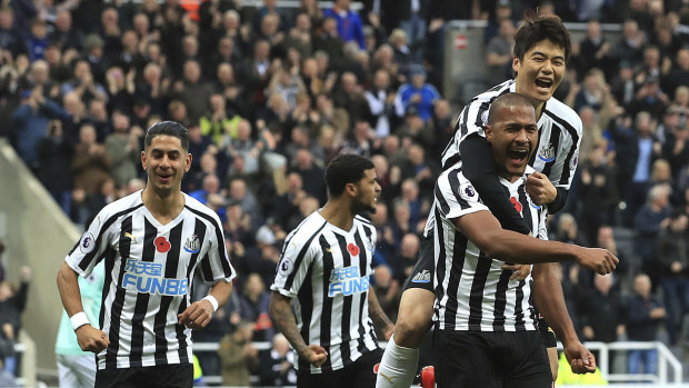 Delight: Newcastle United's Salomon Rondon (right) celebrates scoring his side's first goal against Bournemouth.
