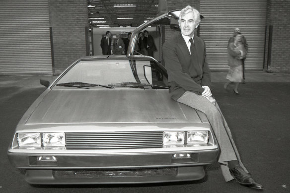 John DeLorean with a prototype of the first DeLorean car.
