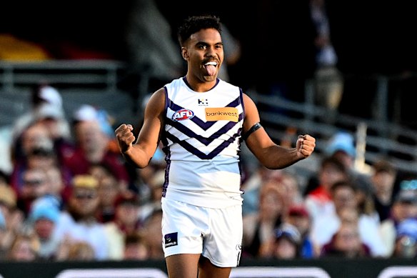 Isaiah Dudley of the Dockers celebrates after kicking a goal.