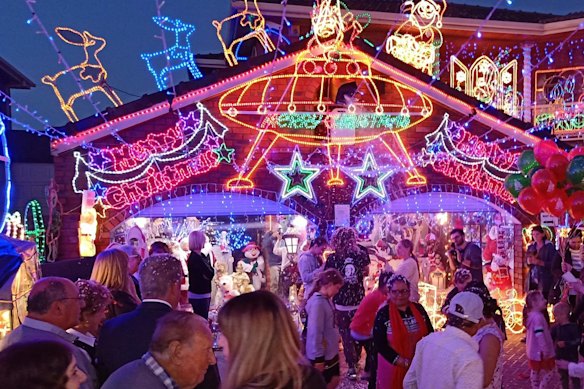 People enjoying the Christmas lights at the Filippini home in 2019. 