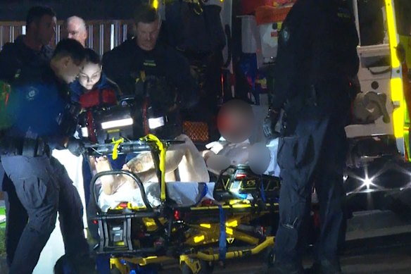 A man was loaded into an ambulance in North Ryde.