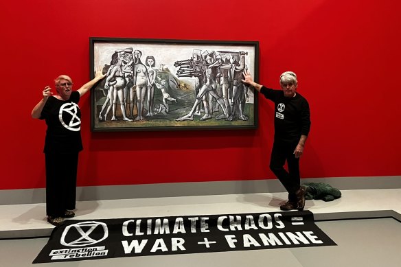 Protesters glue themselves to a Picasso painting at the NGV.