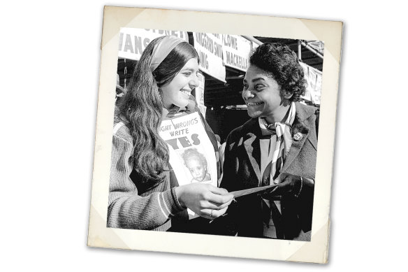 Activist Faith Bandler (right) hands a leaflet to a voter in the 1967 referendum.