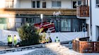 Police officers inspect the area where a fire broke out at the Le Constellation bar and lounge leaving people dead and injured, during New Years celebration, in Crans-Montana, Swiss Alps, Switzerland, Thursday, Jan. 1, 2026. (Alessandro della Valle/Keystone via AP)