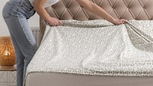 The correct way to put top sheets on the bed is right side down so when you fold them back the print is showing.