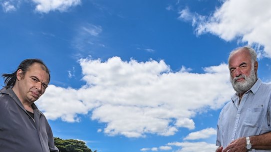 Carl Johnson and Lambis Englezos at the grave of J. Collier, whose war memorial headstone was removed a replaced with a tin plaque.