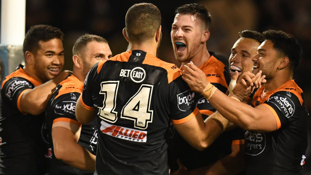 Don't count us out just yet: The Tigers celebrate a try on Thursday night.