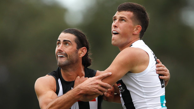 Eyes on the ball: Magpie Brodie Grundy takes on Rowan Marshall of the Saints in the ruck.