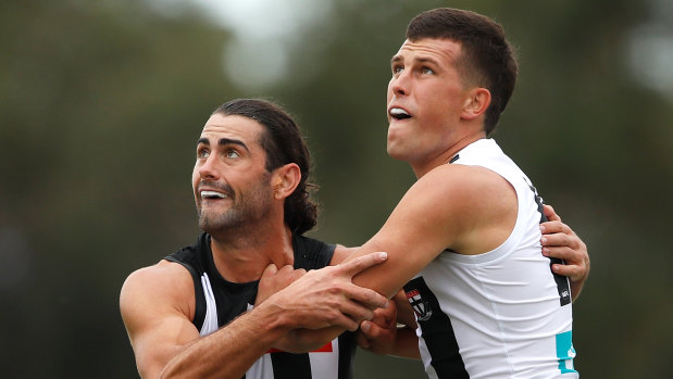 Magpie Brodie Grundy takes on St Kilda's Rowan Marshall.