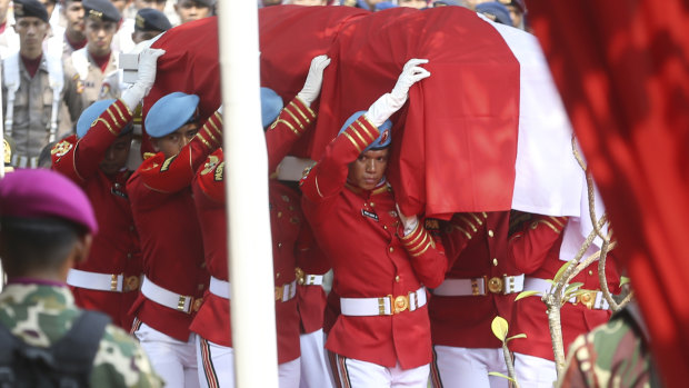 Indonesian soldiers carry the coffin of former president Bacharuddin Jusuf Habibie during the funeral service at Hero's cemetery Kalibata in Jakarta.