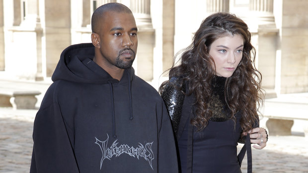 In happier times (although it might not look like it): Kanye West and Lorde at the Christian Dior's Paris Fashion Week show in 2015.