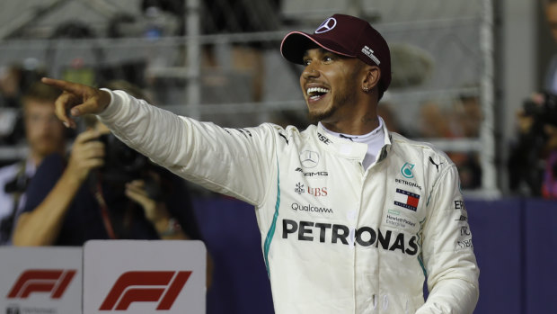 Dominant: Mercedes driver Lewis Hamilton celebrates after taking pole position in Singapore.