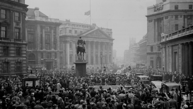Crowds wait in front of the royal exchange, London, for the proclamation of the King's death to be read on February 6, 1952