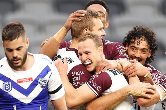 Make that another try ... Manly players celebrate last month’s 66-0 flogging.