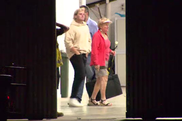 Jackson Warne and his grandmother Brigitte greet the plane carrying the body of Shane Warne at Esssendon fields Airport.