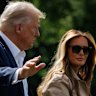 US President Donald Trump, left, and First Lady Melania Trump walk on the South Lawn of the White House before boarding Marine One in Washington, DC, US, on Friday, July 11, 2025. Trump threatened a 35% tariff on some Canadian goods and raised the prospect of increasing levies on most other countries, ramping up his trade rhetoric in comments that weighed on stocks and boosted the US dollar. Photographer: Samuel Corum/Sipa/Bloomberg