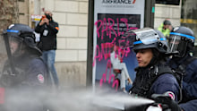 Police spray students with a tear gas during protests in Paris on Wednesday, October 7.